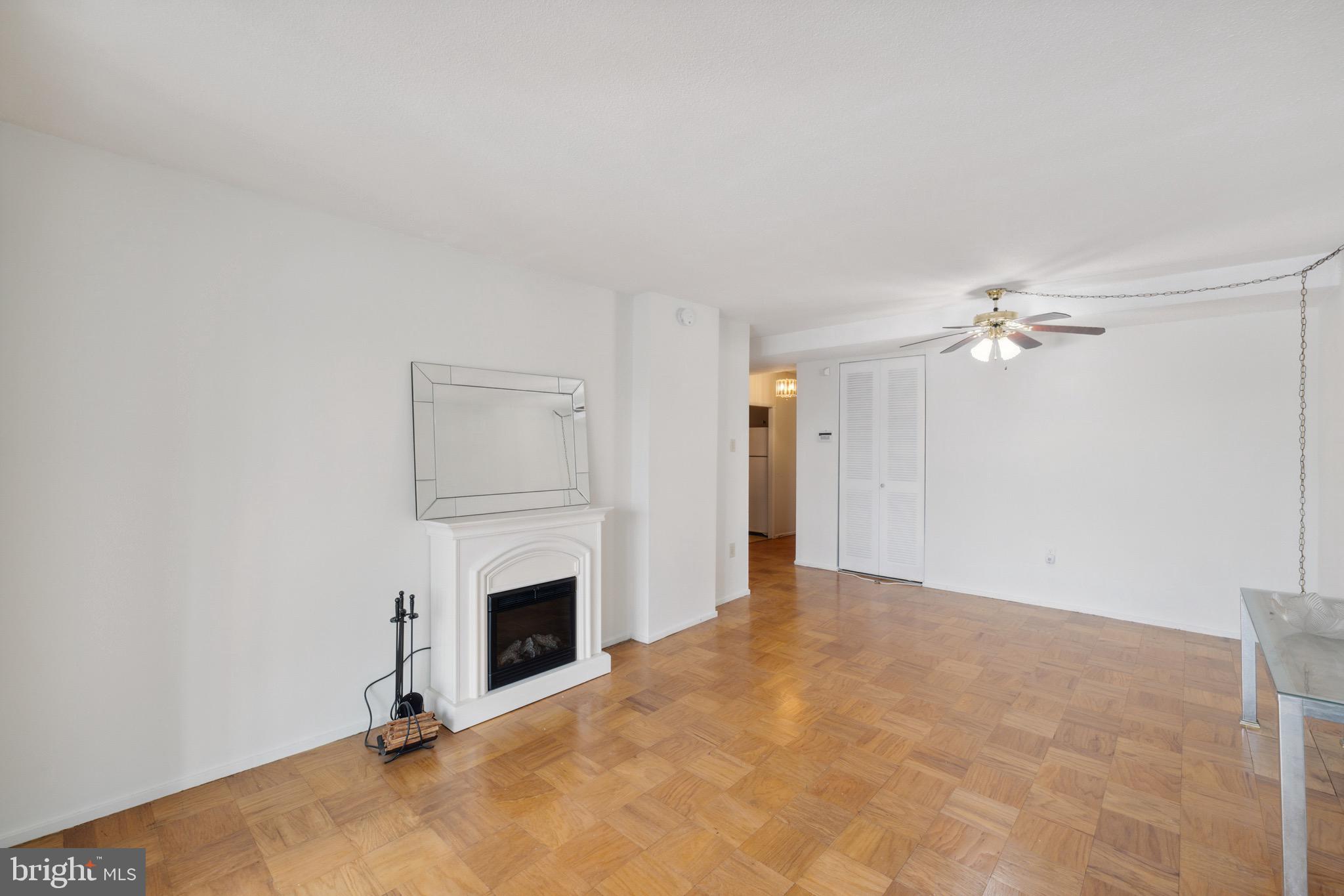 1301 Delaware Avenue Southwest, Unit N403 Washington, DC 20024 - Photo 4 of 14 a view of empty room with fireplace