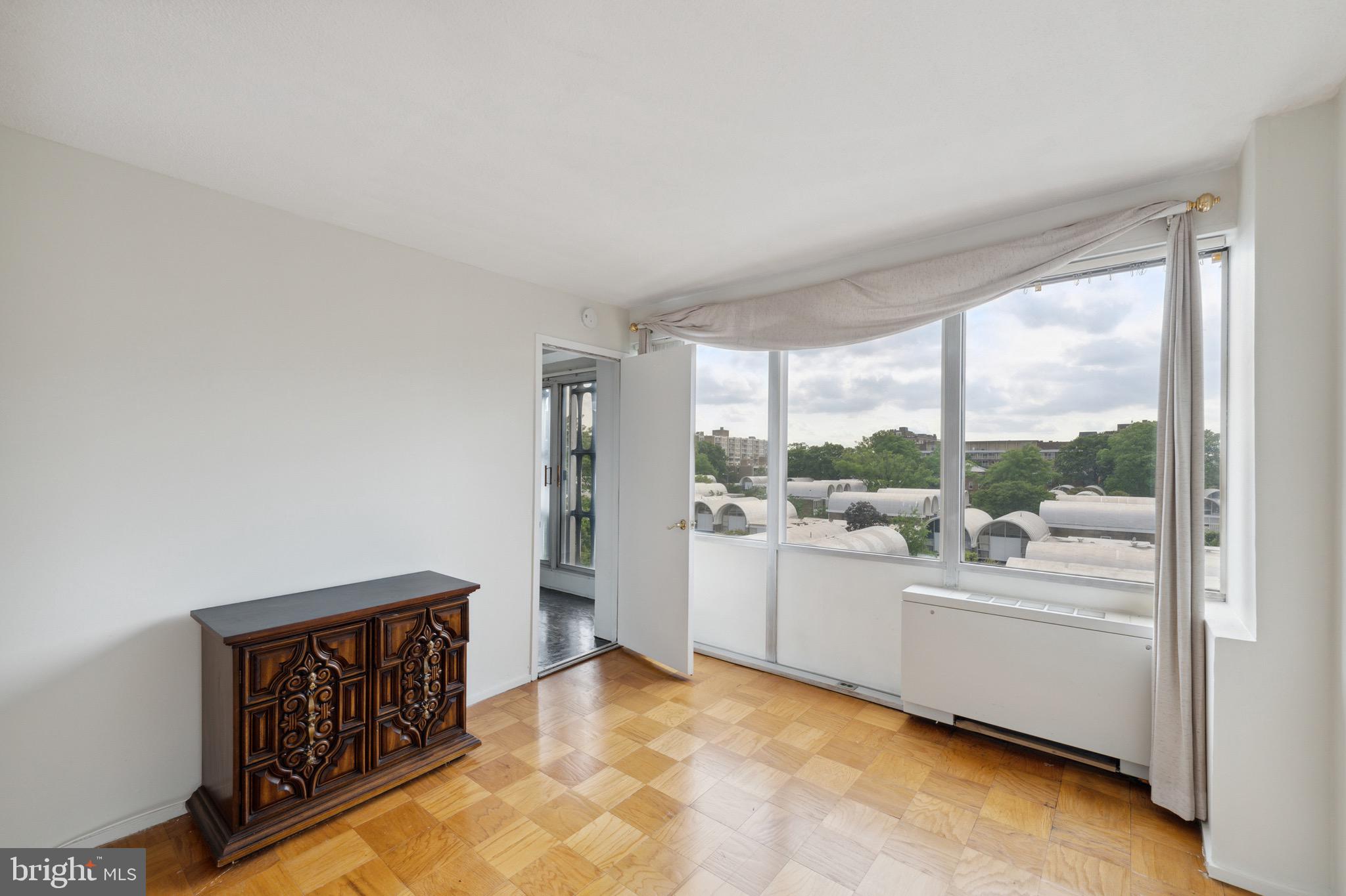 1301 Delaware Avenue Southwest, Unit N403 Washington, DC 20024 - Photo 9 of 14 a room with a large window