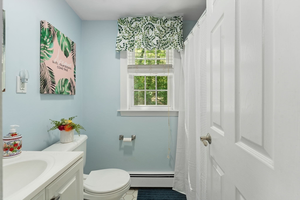 12 Millbrook Road Westwood, MA 02090 - Photo 16 of 28 a white toilet sitting next to a bathroom sink and tub