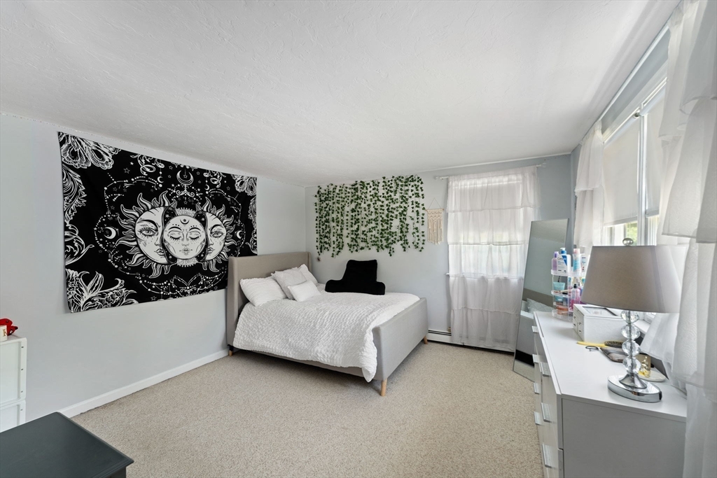 12 Millbrook Road Westwood, MA 02090 - Photo 17 of 28 a bedroom with a bed and a window