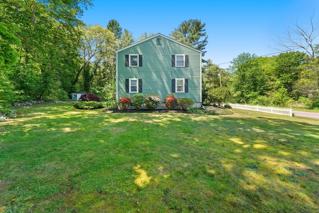 12 Millbrook Road Westwood, MA 02090 - Photo 22 of 28 a view of a big house with a big yard and large trees