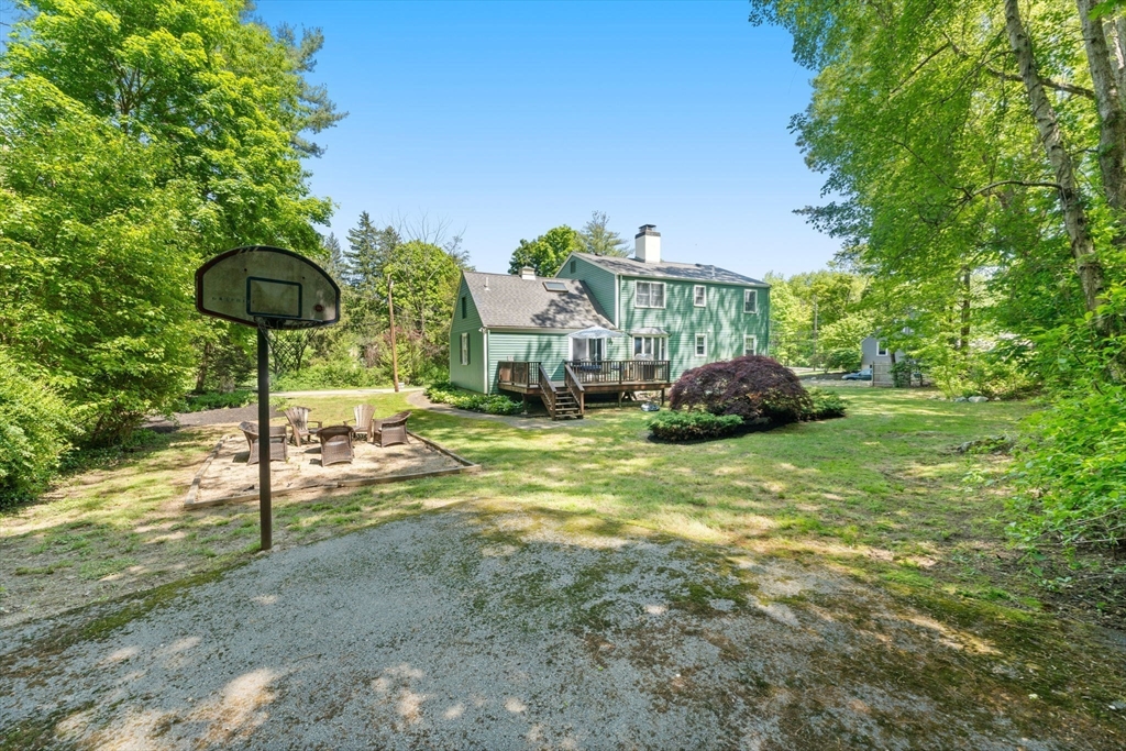 12 Millbrook Road Westwood, MA 02090 - Photo 24 of 28 a view of a house with a yard and sitting area