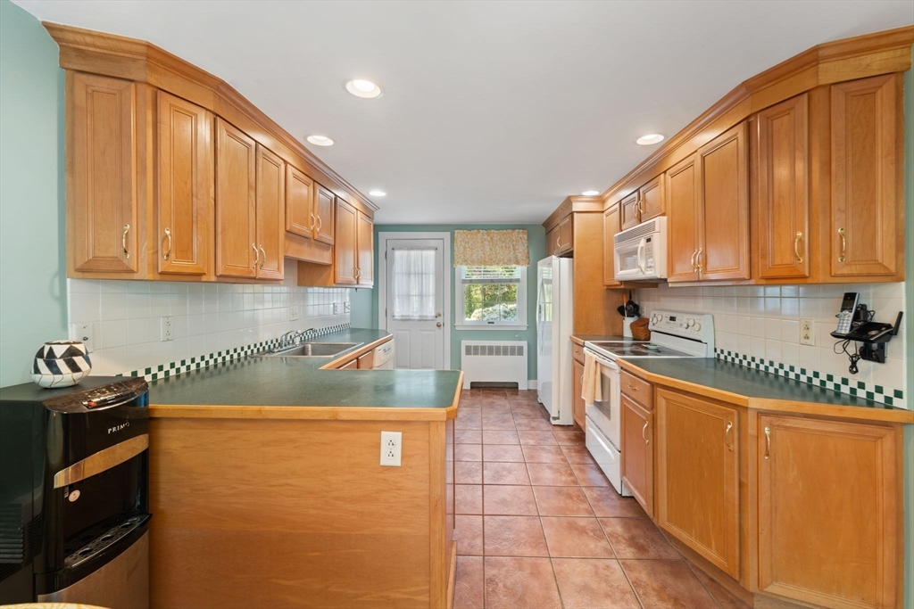 12 Millbrook Road Westwood, MA 02090 - Photo 5 of 28 a kitchen with a sink a stove and cabinets