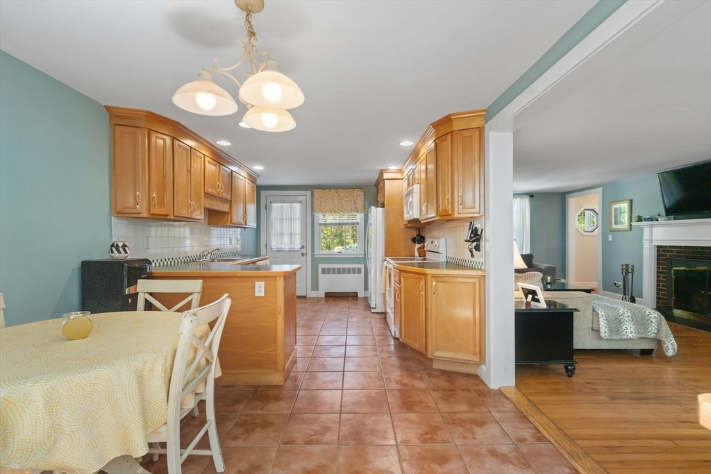 12 Millbrook Road Westwood, MA 02090 - Photo 7 of 28 a kitchen with stove a sink and a refrigerator