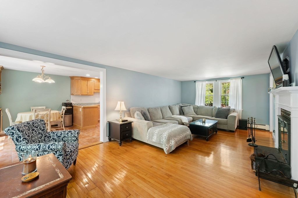 12 Millbrook Road Westwood, MA 02090 - Photo 9 of 28 a living room with furniture and a fireplace