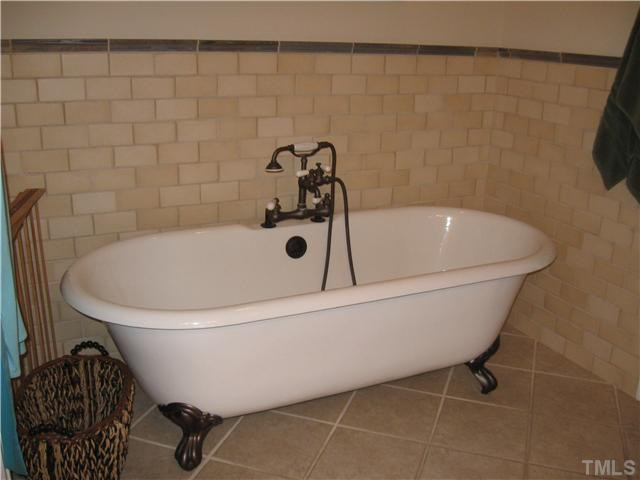 706 Tower Street Raleigh, NC 27605 - Photo 13 of 23 Footed soaking tub...subway tile.. Private water closet.
