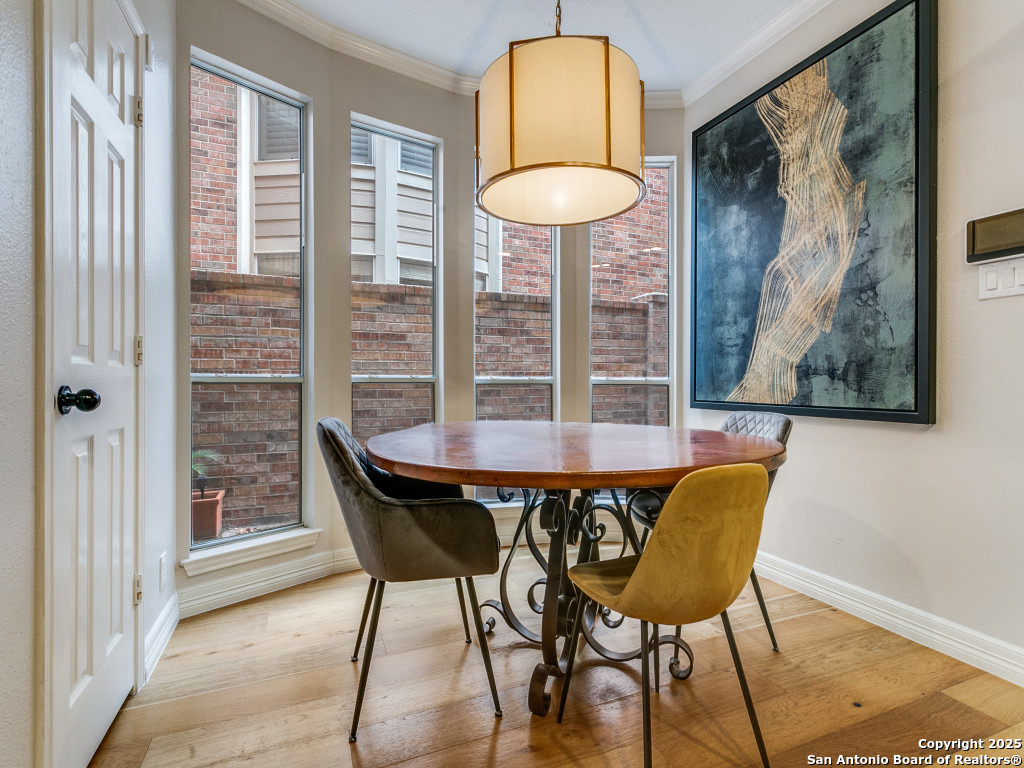 147 Elizabeth Road Alamo Heights, TX 78209 - Photo 11 of 25 a view of a dining room with furniture and wooden floor