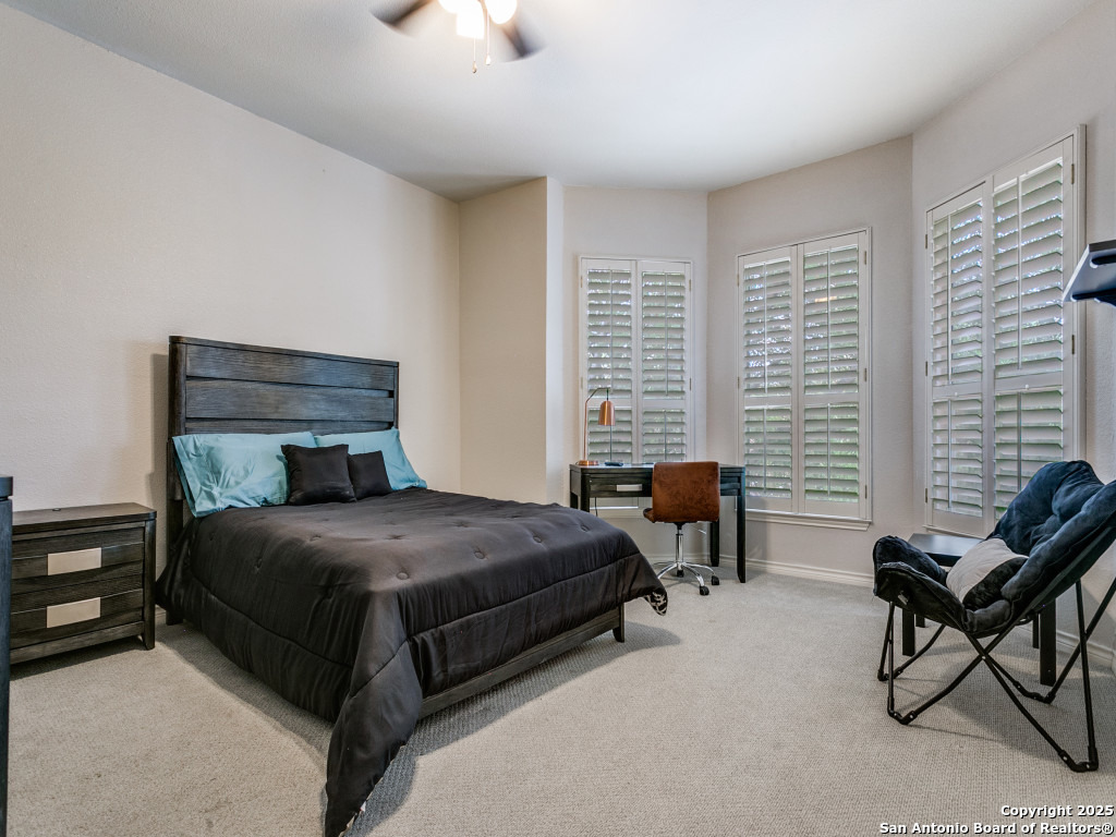 147 Elizabeth Road Alamo Heights, TX 78209 - Photo 15 of 25 a bedroom with a bed chair and a window
