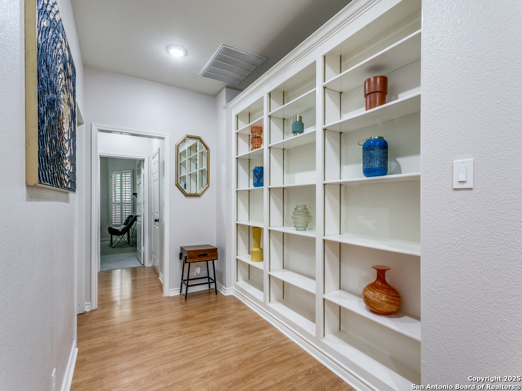 147 Elizabeth Road Alamo Heights, TX 78209 - Photo 16 of 25 a view of a livingroom with shelves