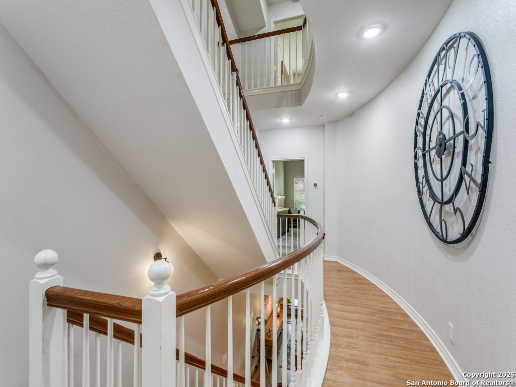 147 Elizabeth Road Alamo Heights, TX 78209 - Photo 17 of 25 a view of staircase with lots of frames and frames on wall