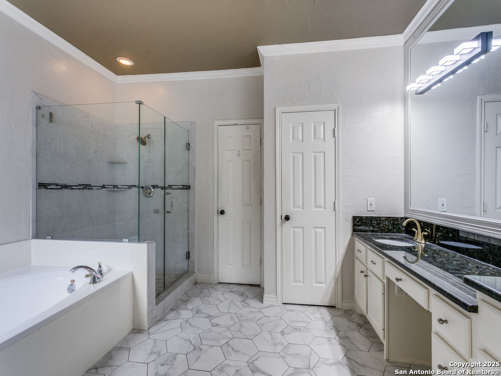 147 Elizabeth Road Alamo Heights, TX 78209 - Photo 19 of 25 a bathroom with a granite countertop sink a toilet and bathtub