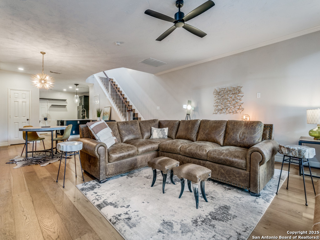 147 Elizabeth Road Alamo Heights, TX 78209 - Photo 8 of 25 a living room with furniture and a chandelier