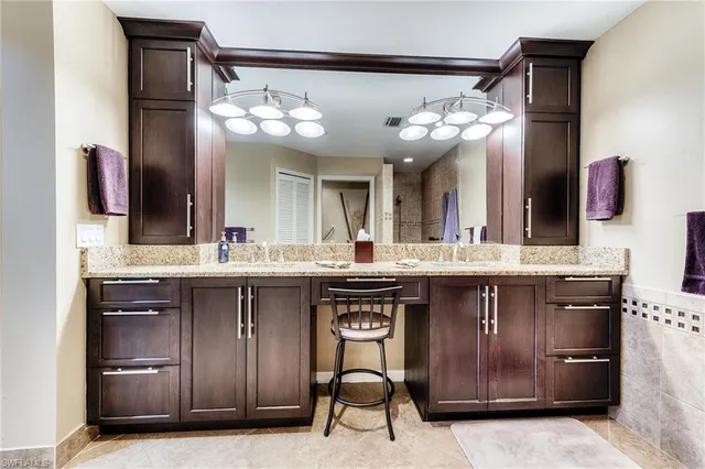 a kitchen with a sink and a refrigerator