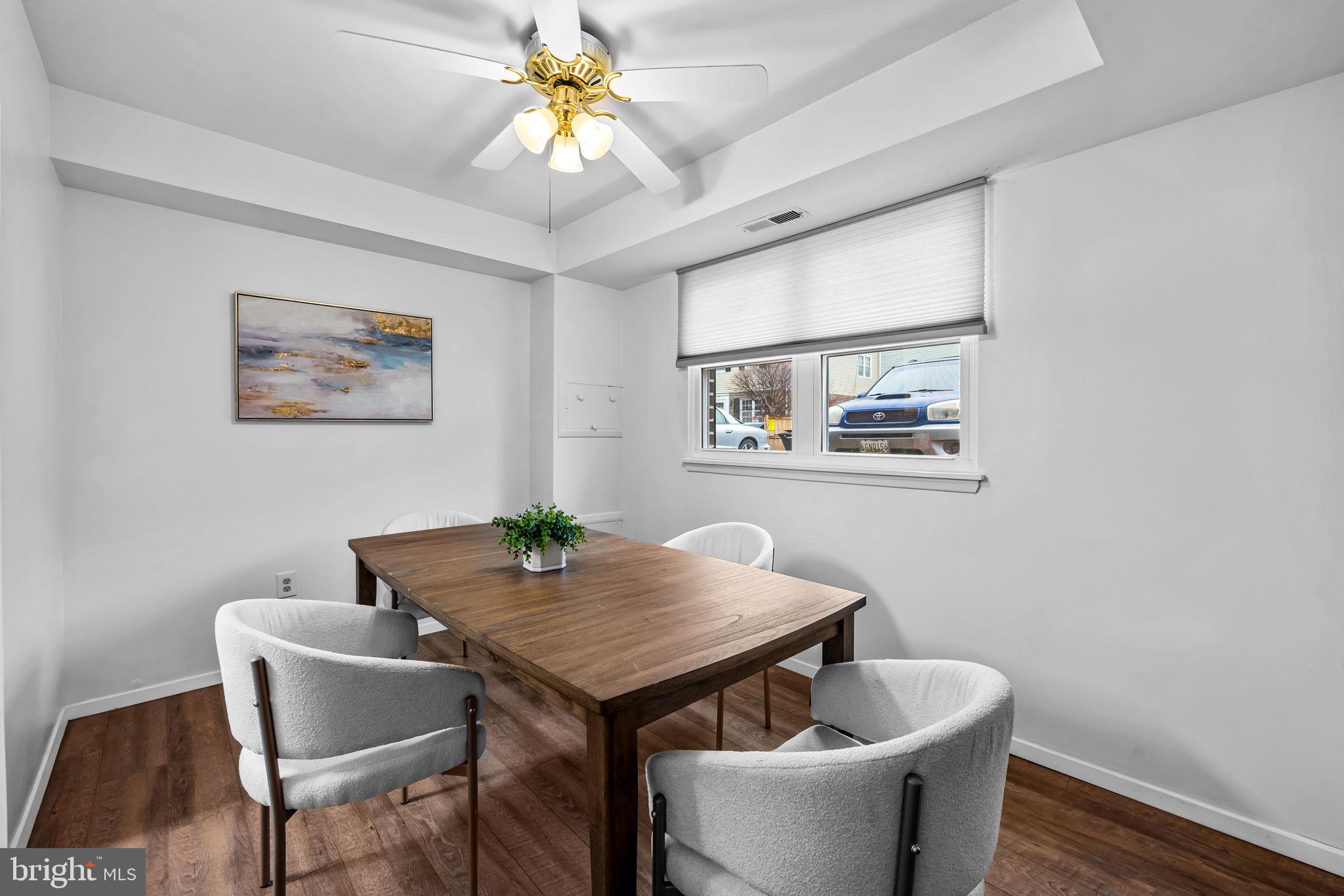 12 Cardor Court, Unit 100 Nottingham, MD 21236 - Photo 12 of 21 a view of a dining room with furniture and wooden floor