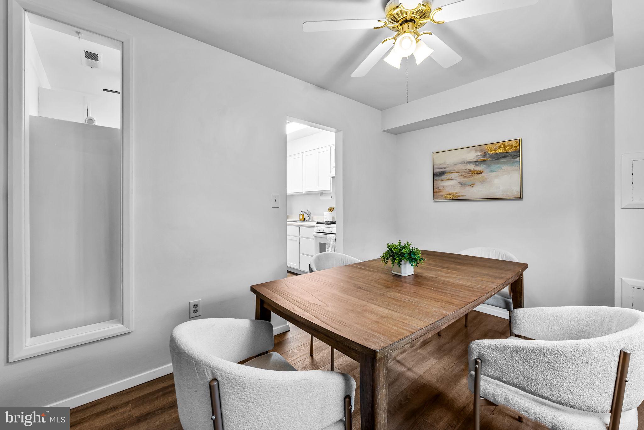 12 Cardor Court, Unit 100 Nottingham, MD 21236 - Photo 14 of 21 a view of a dining room with furniture and a chandelier
