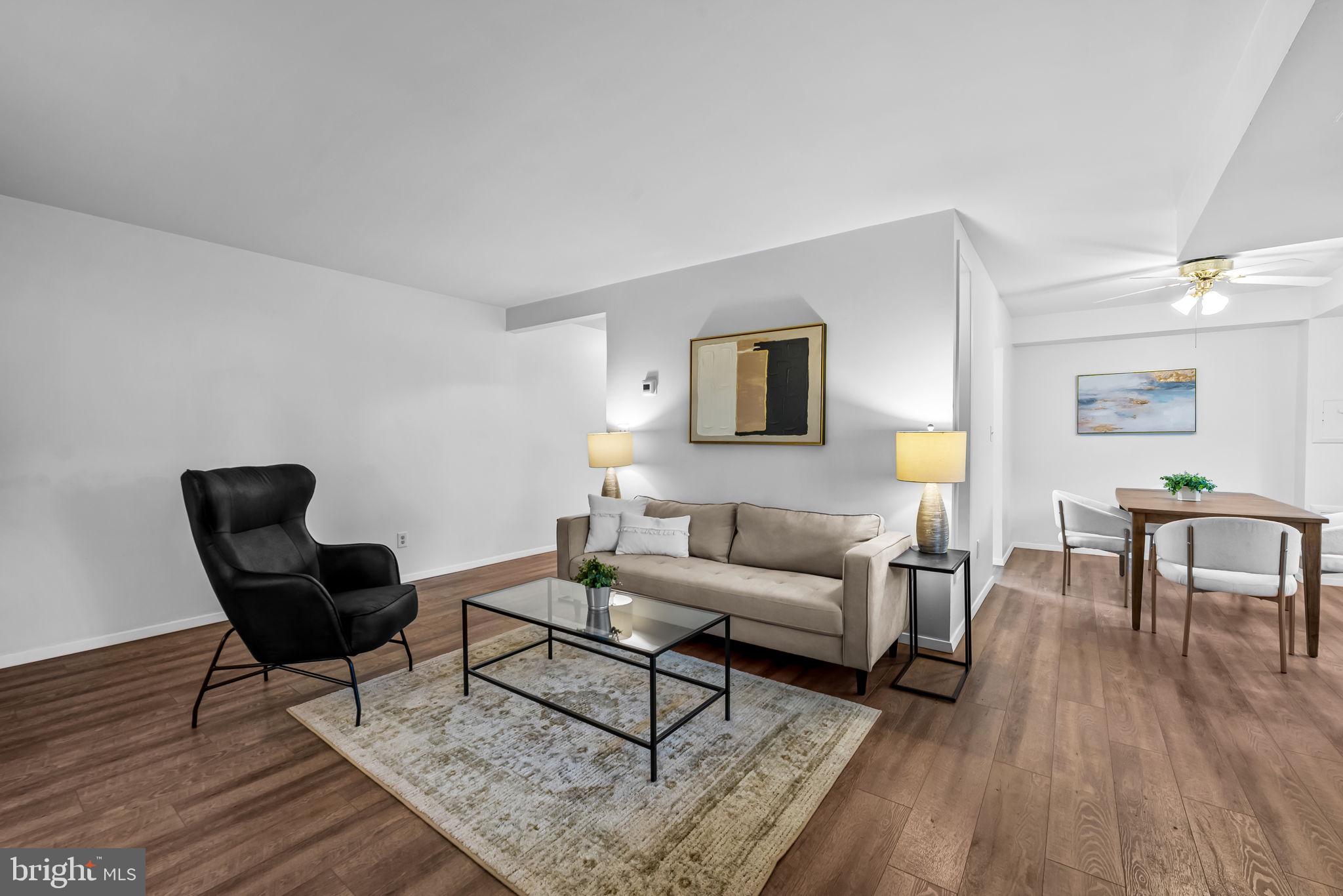 12 Cardor Court, Unit 100 Nottingham, MD 21236 - Photo 6 of 21 a living room with furniture and a wooden floor