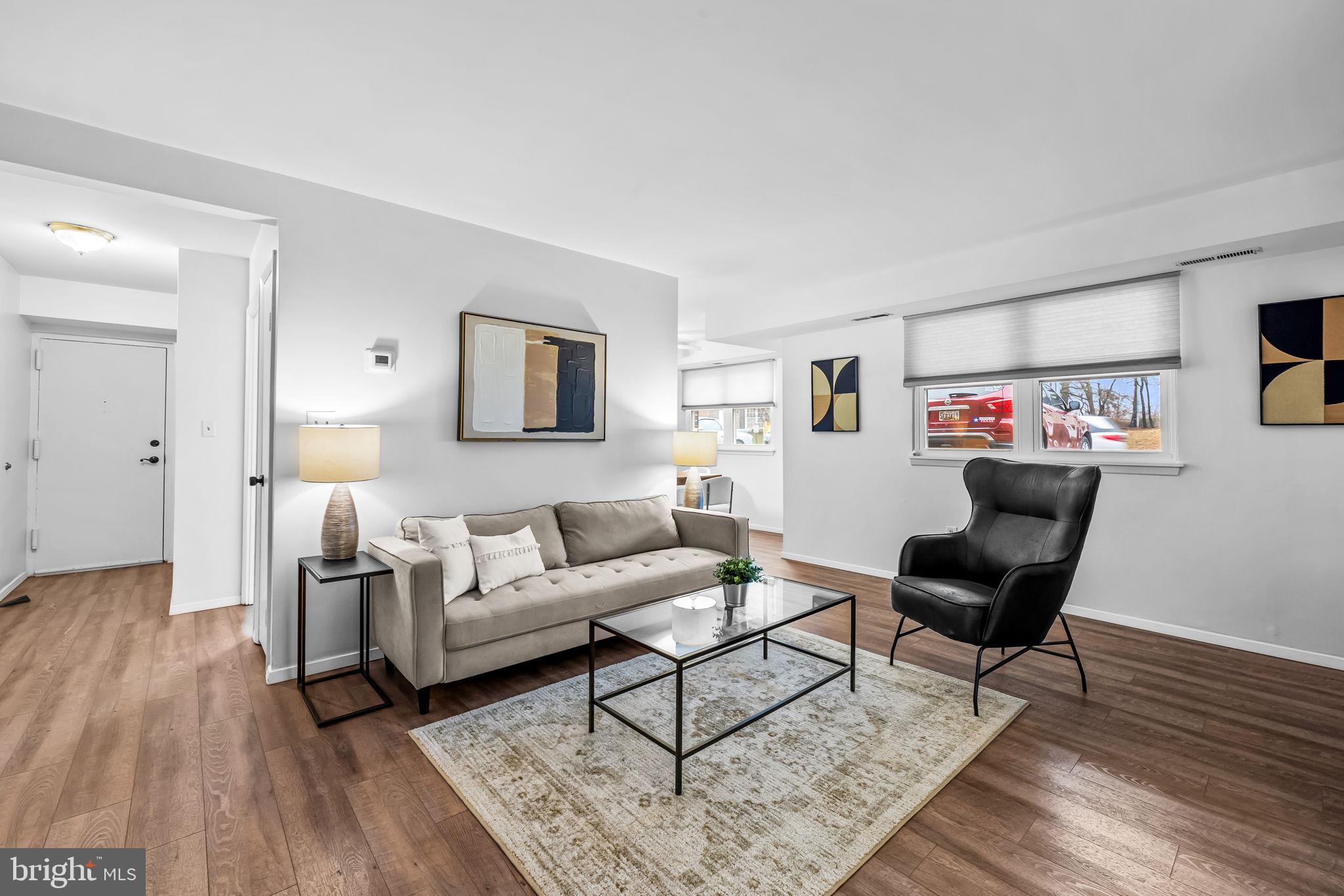 12 Cardor Court, Unit 100 Nottingham, MD 21236 - Photo 7 of 21 a living room with furniture and a wooden floor