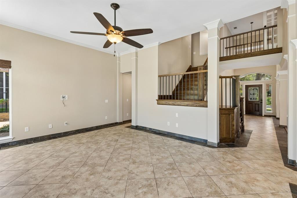 2925 Sunset Ridge McKinney, TX 75072 - Photo 10 of 33 This expansive open-concept family room with soaring ceilings and elegant architectural details, has a seamless flow between the main living spaces, perfect for entertaining family and friends.