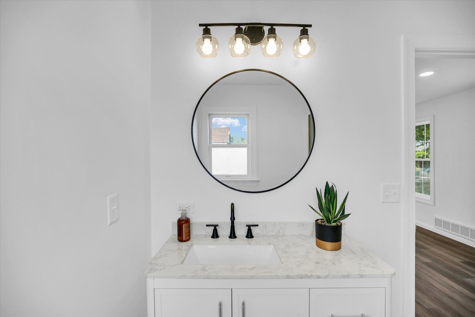 1212 West Healey Street Champaign, IL 61821 - Photo 28 of 63 a bathroom with a sink and a mirror