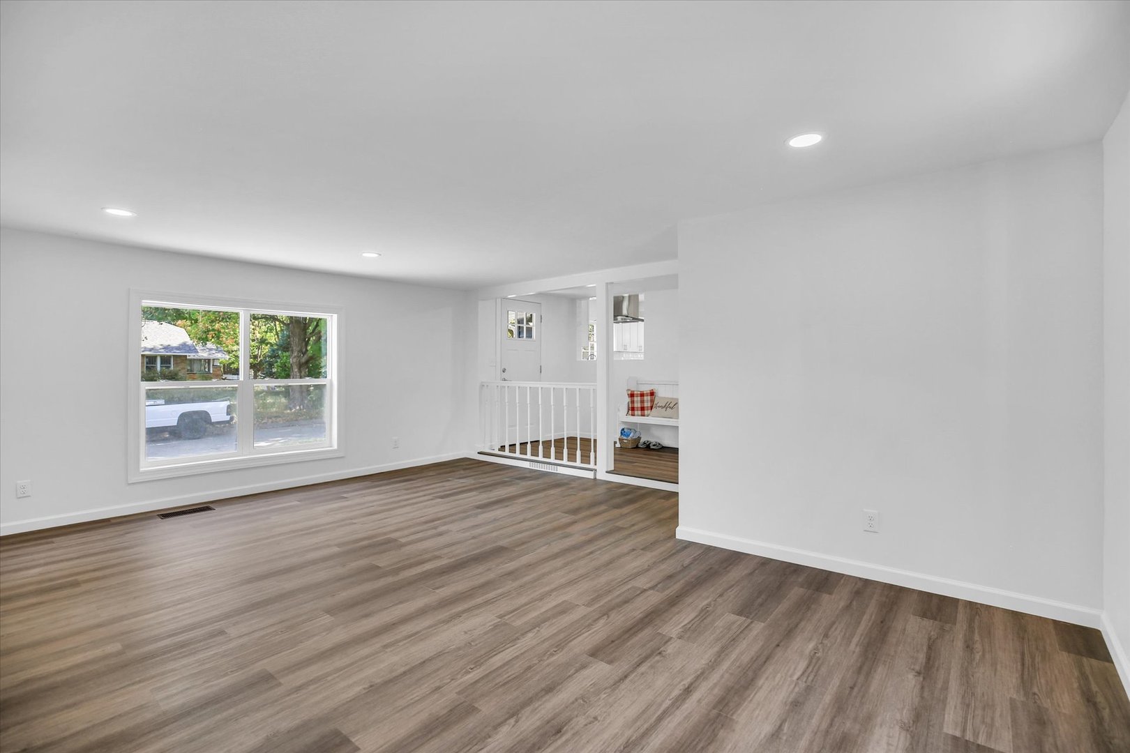 1212 West Healey Street Champaign, IL 61821 - Photo 35 of 63 a view of empty room with wooden floor and fan