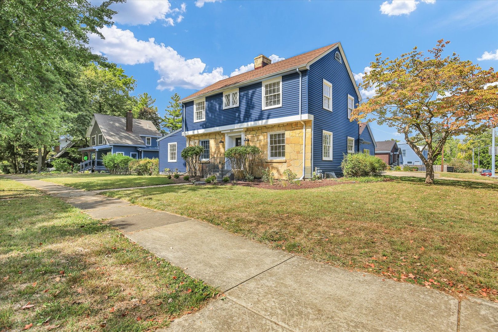 1212 West Healey Street Champaign, IL 61821 - Photo 5 of 63 a front view of a building with a garden
