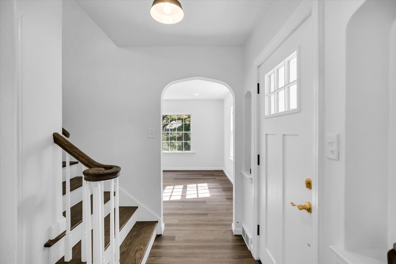 1212 West Healey Street Champaign, IL 61821 - Photo 8 of 63 a view of entryway with wooden floor