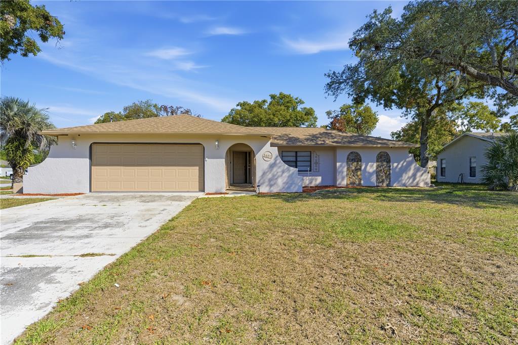 8403 Elgrove Street Spring Hill, FL 34608 - Photo 1 of 1 front view of a house with a yard