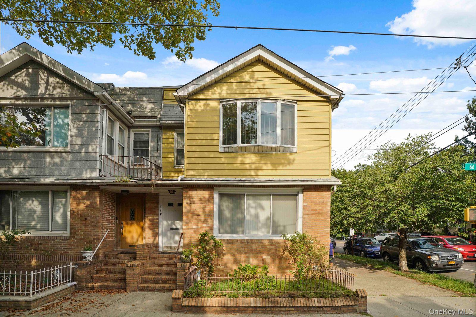 70-49 66th Place Queens, NY 11385 - Photo 1 of 1 a front view of a house with yard
