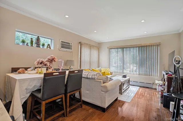 a view of a dining room with furniture and a chandelier