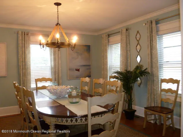 a view of living room with furniture and a lamp