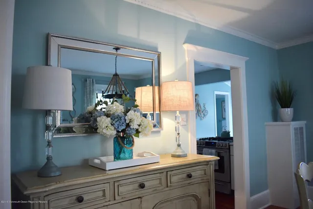 a dining room with furniture and wooden floor