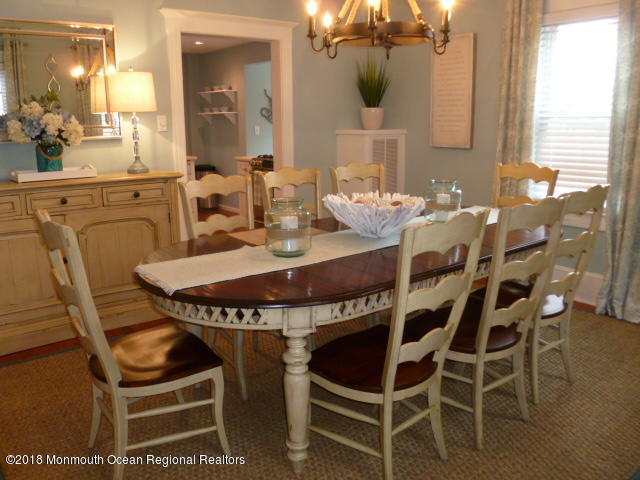 422 Worthington Avenue, Unit SUMMER 2026 Spring Lake, NJ 07762 - Photo 15 of 57 a dining room with furniture and wooden floor