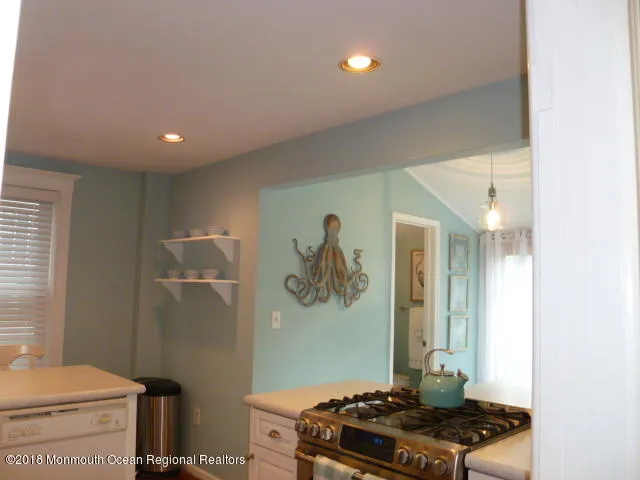 a kitchen with a stove and a kitchen