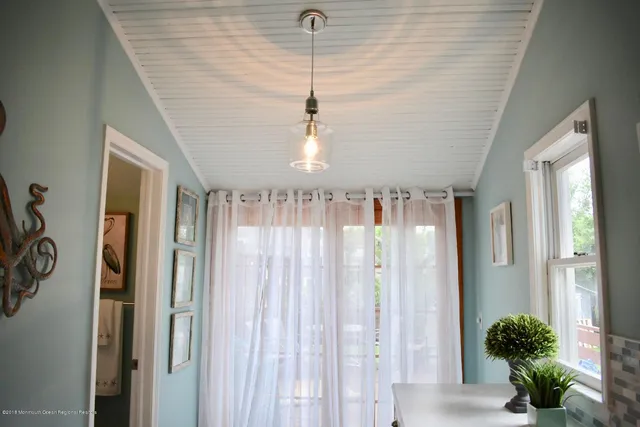 a bedroom with a bed and a lamp