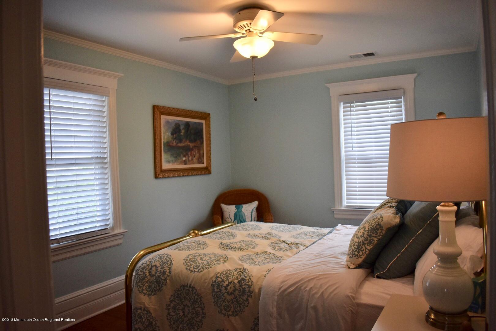 422 Worthington Avenue, Unit SUMMER 2026 Spring Lake, NJ 07762 - Photo 31 of 57 a bedroom with a bed and a window