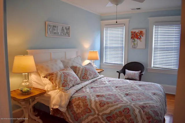 a bathroom with a toilet and a picture on the wall