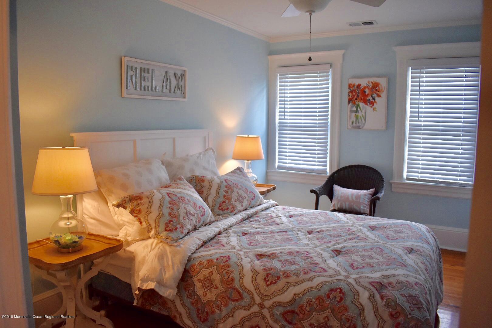 422 Worthington Avenue, Unit SUMMER 2026 Spring Lake, NJ 07762 - Photo 37 of 57 a bedroom with two beds and a window