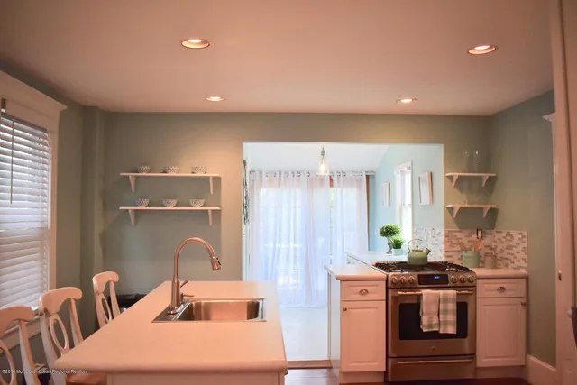 a bed room with a bed and a night stand