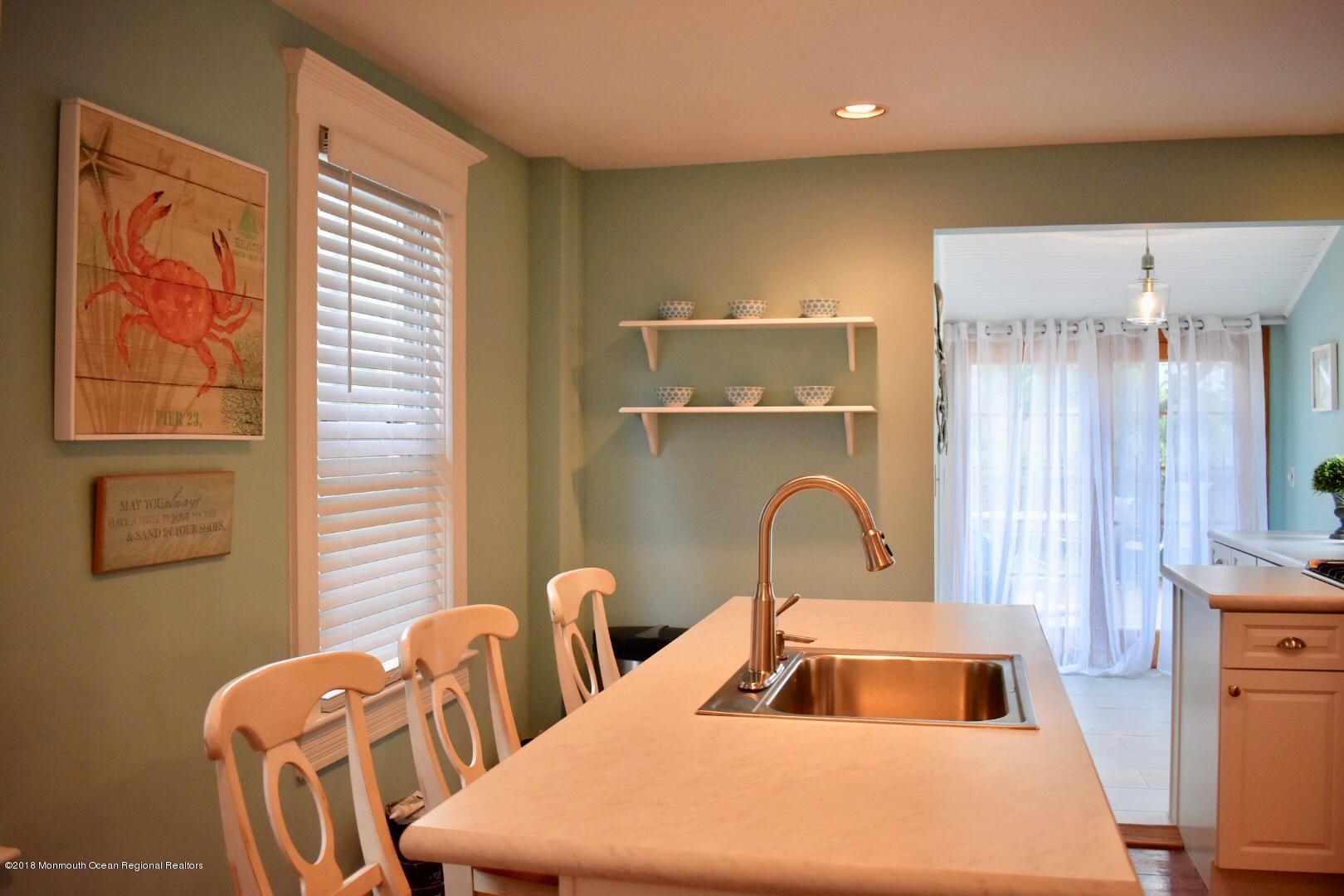 422 Worthington Avenue, Unit SUMMER 2026 Spring Lake, NJ 07762 - Photo 44 of 57 a bedroom with bed and a window