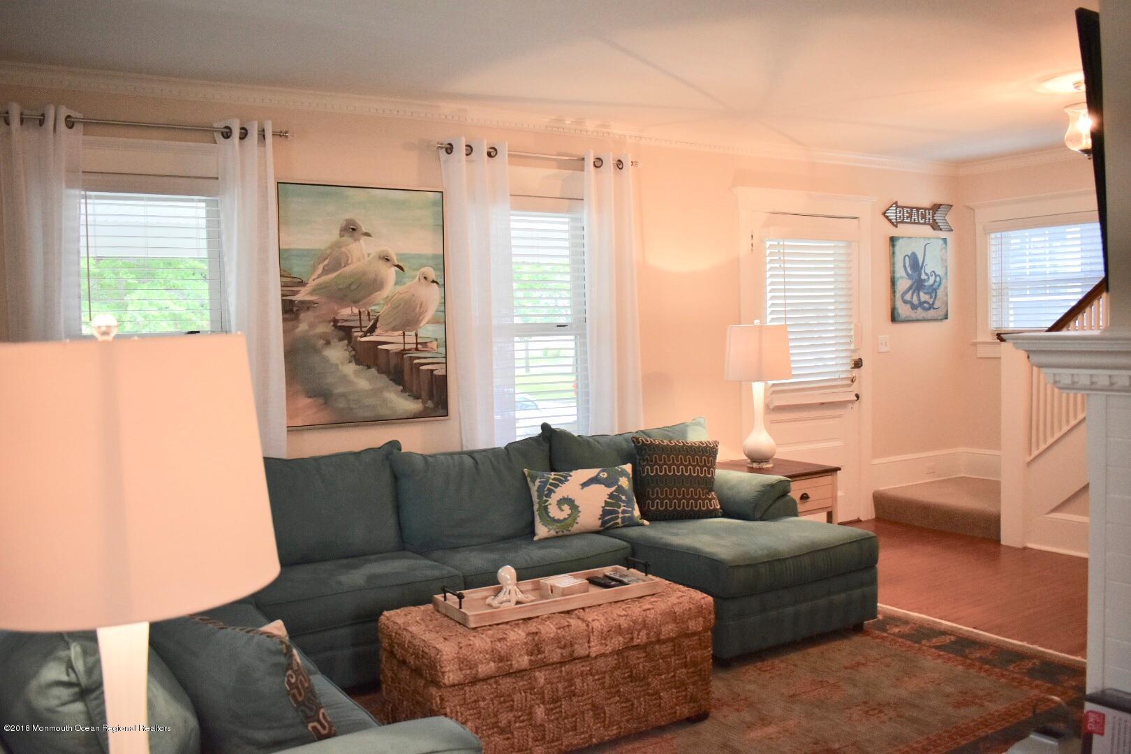 422 Worthington Avenue, Unit SUMMER 2026 Spring Lake, NJ 07762 - Photo 10 of 57 a living room with furniture and a large window