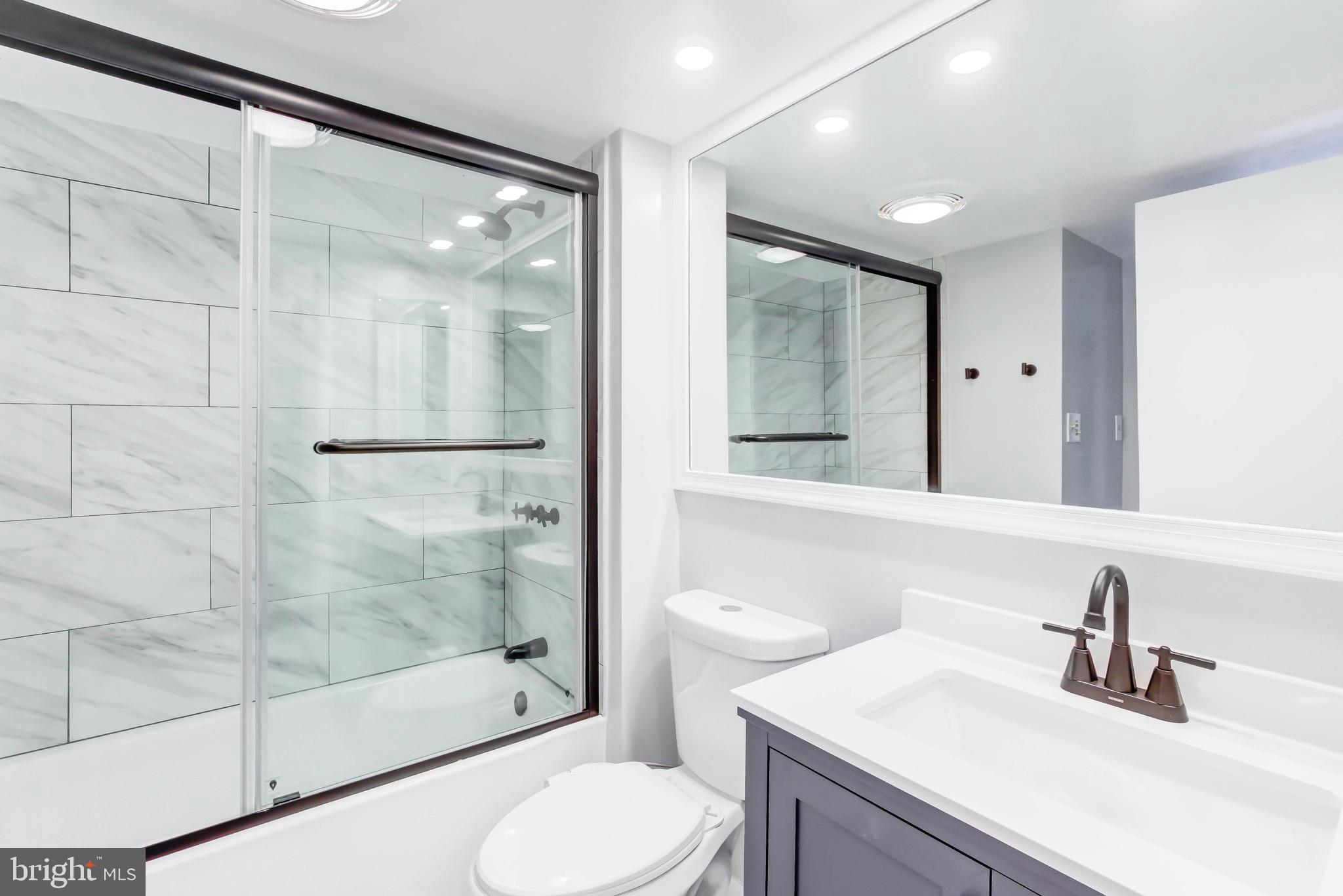 2111 Wisconsin Avenue Northwest, Unit 302 Washington, DC 20007 - Photo 11 of 23 a bathroom with a sink toilet and shower