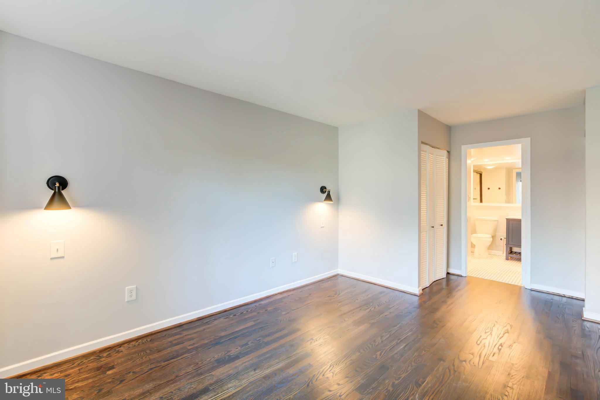 2111 Wisconsin Avenue Northwest, Unit 302 Washington, DC 20007 - Photo 15 of 23 a view of empty room with wooden floor