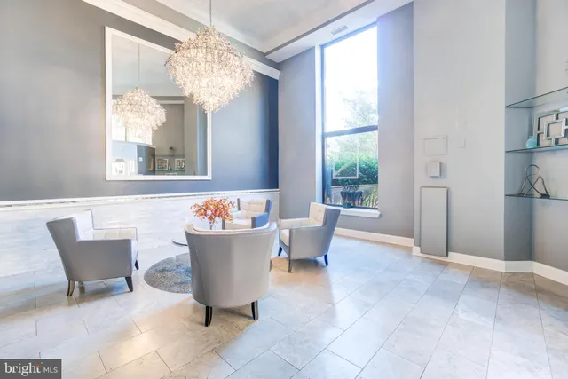 a view of a dining room with furniture wooden floor and chandelier