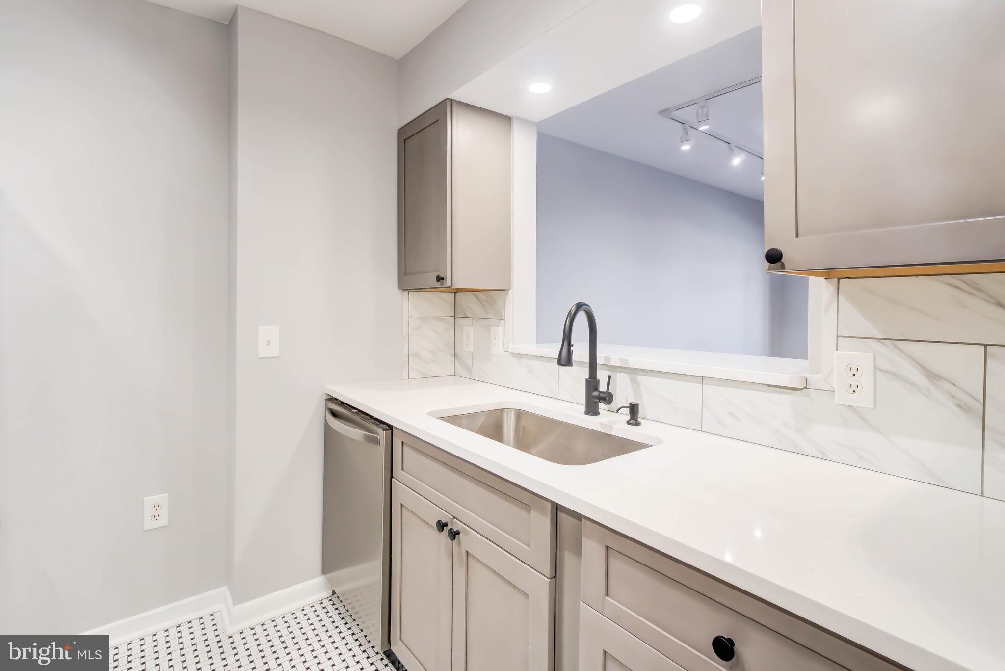 2111 Wisconsin Avenue Northwest, Unit 302 Washington, DC 20007 - Photo 5 of 23 a close view of sink and tap