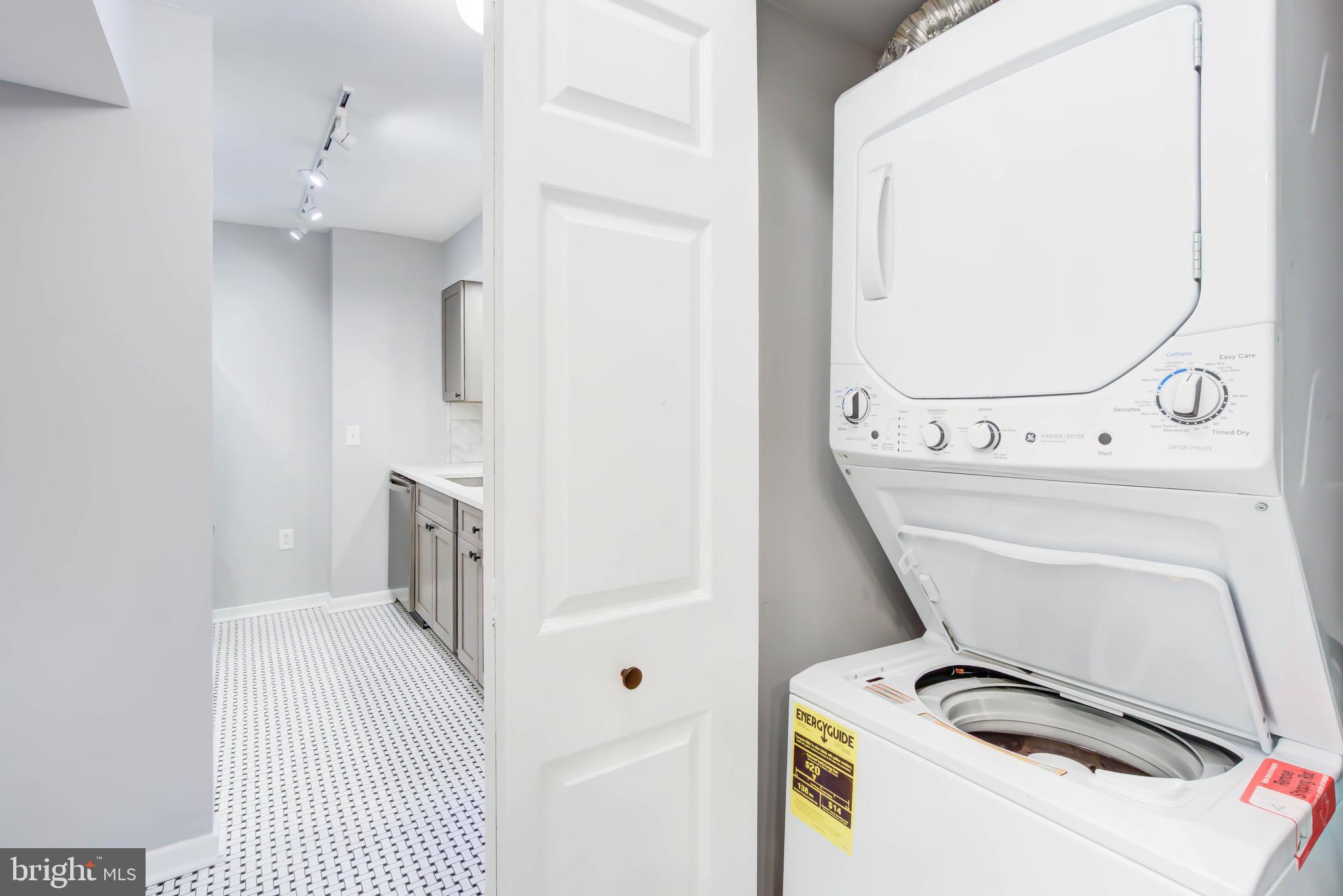 2111 Wisconsin Avenue Northwest, Unit 302 Washington, DC 20007 - Photo 10 of 23 a utility room with dryer and washer