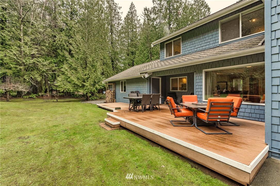 5524 Knight Road Bellingham, WA 98226 - Photo 4 of 34 a view of a house with backyard sitting area and garden