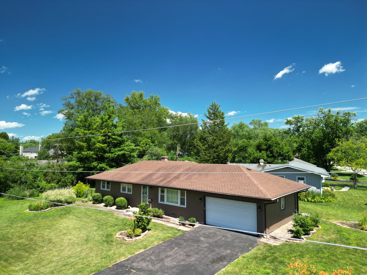 2 Northcrest Road Lake Zurich, IL 60047 - Photo 20 of 30 a aerial view of a house with swimming pool and garden
