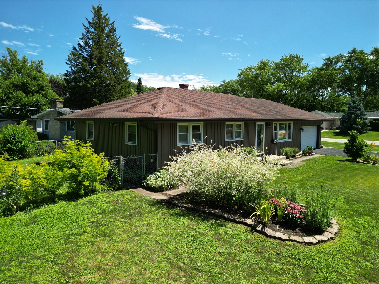 2 Northcrest Road Lake Zurich, IL 60047 - Photo 26 of 30 a front view of a house with a garden