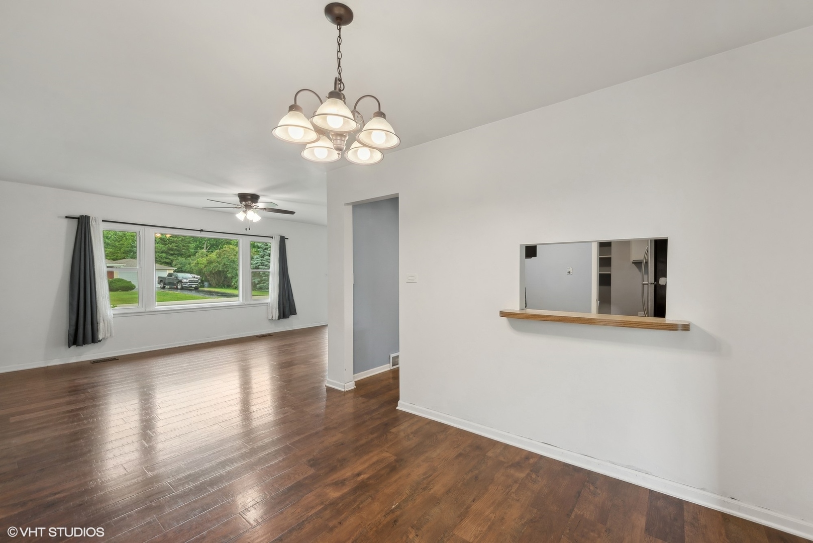 2 Northcrest Road Lake Zurich, IL 60047 - Photo 6 of 30 a view of a room with wooden floor and chandelier