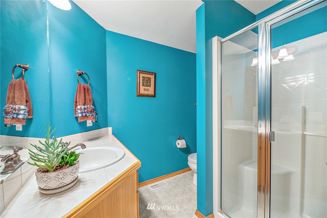 1117 184th Place Southeast Bothell, WA 98012 - Photo 22 of 40 a room with a sink and a mirror
